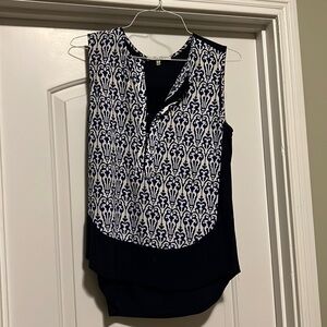 Long dressy tank, solid navy in back. Shorter in front